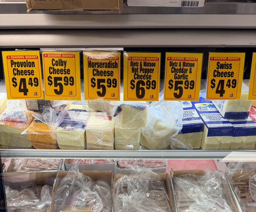 Deli case with cheeses and sausages